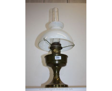 A brass Oil Lamp with opaque glass shade.