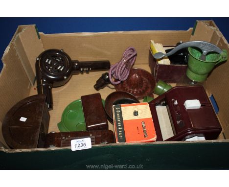A quantity of assorted Bakelite items including lemon squeezer, camera, hairdryers, etc