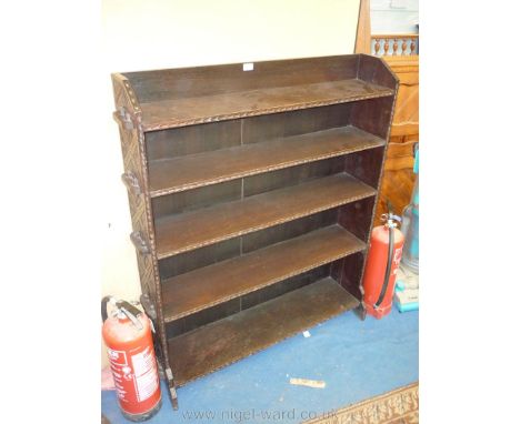 A Victorian floor standing dark Oak Bookshelves having five shelves, 39'' wide, 48 1/2'' high, having pegged shelf retainers 