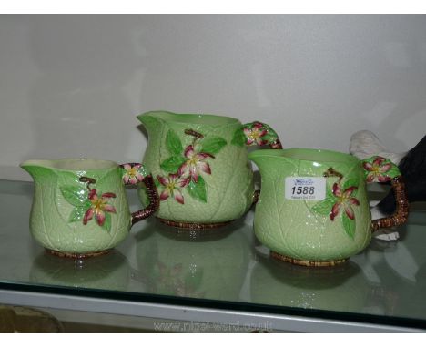 A set of three Carltonware 'Apple Blossom' jugs.