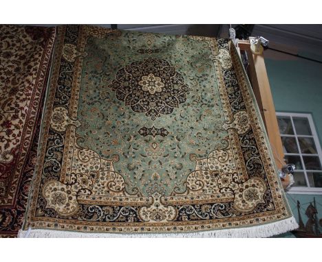 A green ground Keshan Carpet, 2.3 x 1.6 metres