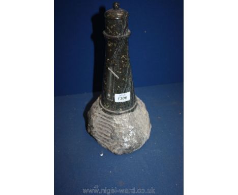 A polished stone Lighthouse on rough stone stand, possibly was a novelty thermometer, a/f, 13 1/2" tall.