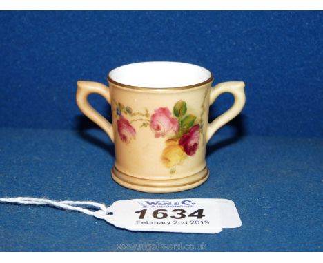 A miniature Royal Worcester blush, hand-painted, two handled Mug