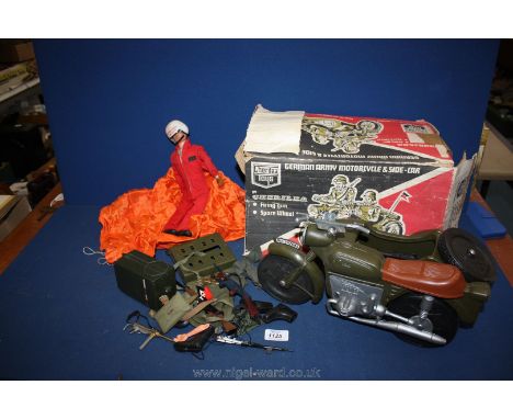 An Action Man red devil, Action Man accessories and a Cherilea army motorbike and sidecar.