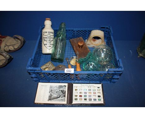 A box of bookbinding tools, compendium of precious stone specimens, glass balls, an antique shop counter bell, etc.