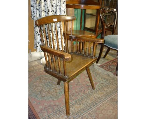 A primitive comb/stick back corner kitchen Chair having scroll end arms, solid seat and simple legs