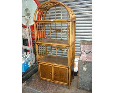 A modern Cane arched top Shelf/cupboard unit having opposing double doors to the base, 29 1/2'' wide x 16 12/'' deep x 69 1/4