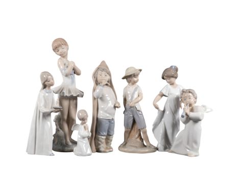 A group of Lladro and NAO figurines, including girl carrying a candle, NAO ballerina, H29cm (7) 