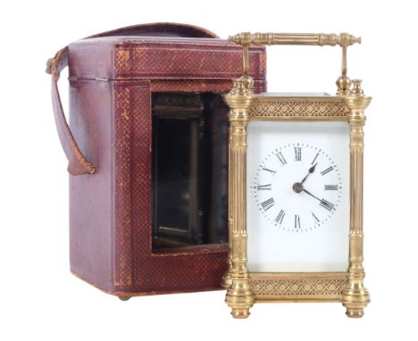 A brass-cased carriage clock, with column pillar supports and swing handle, back plate no. 27, in leather travelling case wit