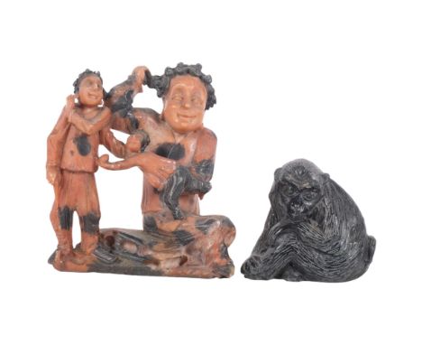 A soapstone carving of 3 figures, H14cm, and carved stone baboon 