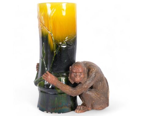 A large Majolica Bretby pottery monkey umbrella stand, in the form of a monkey holding a tree trunk with bamboo, model no. 12