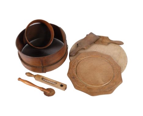 A carved wood breadboard with floral design, 30cm, chopping board, butter pats, 2 sieves, pastry cutter, and a thermometer 