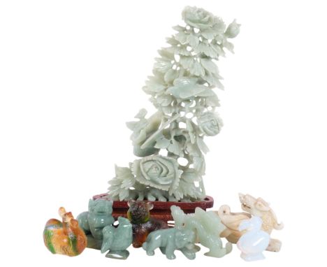 A sculptural jade Oriental floral carving, on modern stained wood base, height including base 34cm, a group of jadeite figuri