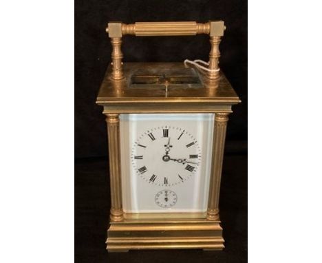 A French gilded carriage clock with alarm an eight day spring-driven movement striking on a gong. Back plate engraved J.L.G B