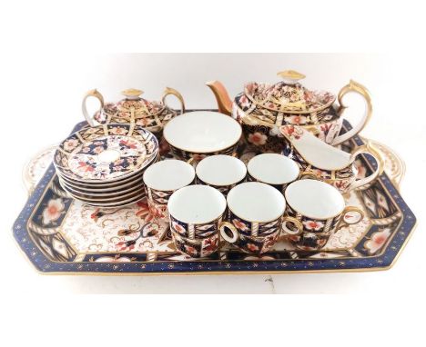 A group of 43 pieces of Royal Crown Derby Imari pattern 2451, to include a matched cabaret set ( matched due to different dat