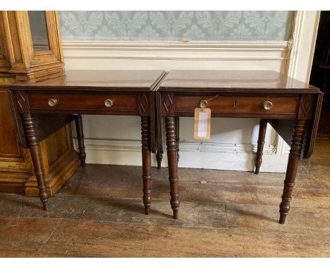 A pair of Victorian and later mahogany sofa tables, reeded edge top with twin dropleaves, single frieze drawer, raised on tur