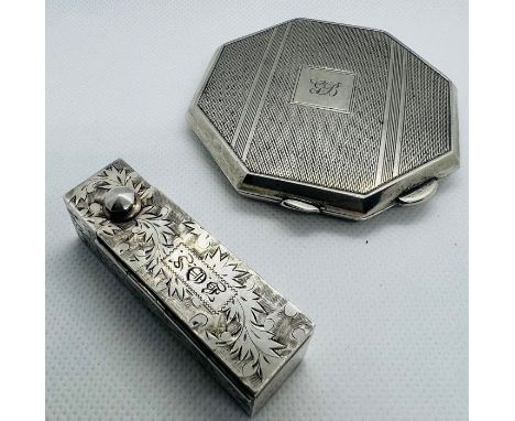 A sterling silver Octagonal mirrored compact, with engine turned pattern and engraved with the initials GB. Marked for WI Bro