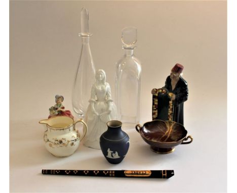 Two modern decanters and stoppers, a Royal Doulton figure "Cissie", a Cooper Clayton carpet vendor figure, a Carltonware "Rou