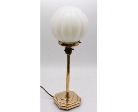 **For sale in aid of BBC Children in Need** Brass table lamp with opaline globe. Height approx 43cm No buyer’s premium to be 