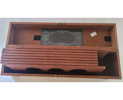 A Stanley of London Late 19th early 20th century boxed sets of 21 magic lantern slides, mostly of comical interest and in col