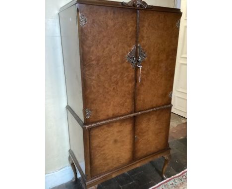 Fine walnut veneer 1958 Cocktail cabinet ( Likely Heals) owned from New by the vendors Mother. A classic 1950s cabinet with 2