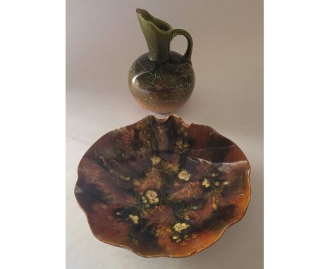 An Aesthetic Movement art pottery Linthorpe Pottery ewer shape no. 1289, 17.5cm high and a Linthorpe dish shape number 276 , 