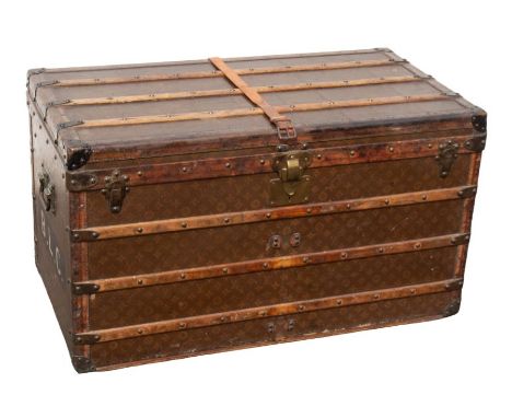 Louis Vuitton - A vintage early 20th Century trunk with leathered "LV" design to all sides, the exterior with wooden slats, l
