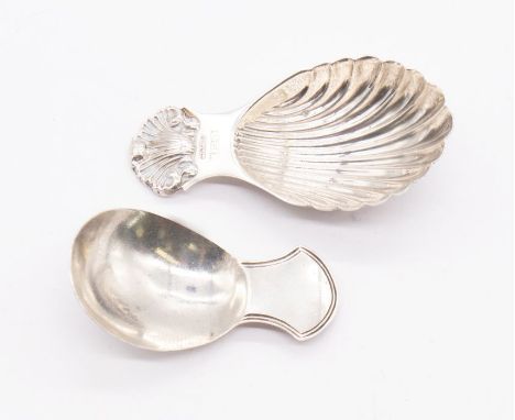 Two sterling silver caddy spoons. The first a George III, marked for JS, with a threaded handle The second a modern cast exam