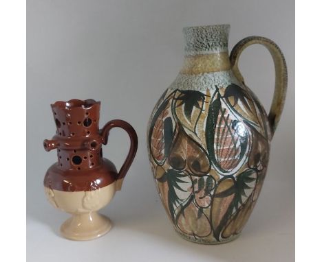 A Bourne Denby Stoneware coloured&nbsp;puzzle jug C1900. Standing 21 cm tall and a large hand decorated Bourne Denby Stonewar