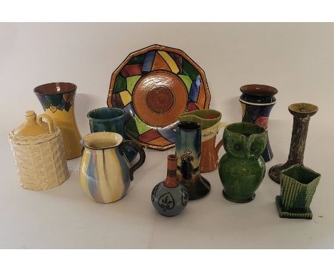 A group of Torquay pottery , to include a plate , a lidded pot in the form of a basket covered flagon , and owl jug , 6 vases