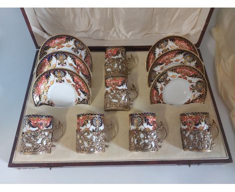 A boxed early 20th C set of Royal Crown Derby, Jays of Kings Road Brighton, Imari coffee cans and saucers set. In stamped sil