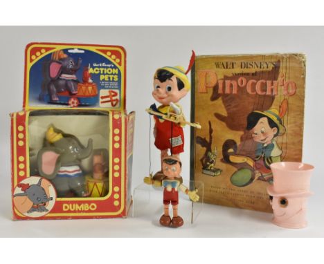 Walt Disney Dumbo battery operated, plastic, made in Hong Kong, pop up action, in original box; Pinocchio moveable figure; Pi
