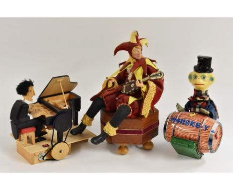 A wooden automaton, piano player; a clockwork automaton Jester, with a lute, his right arm moves; a tinplate monkey pushing w