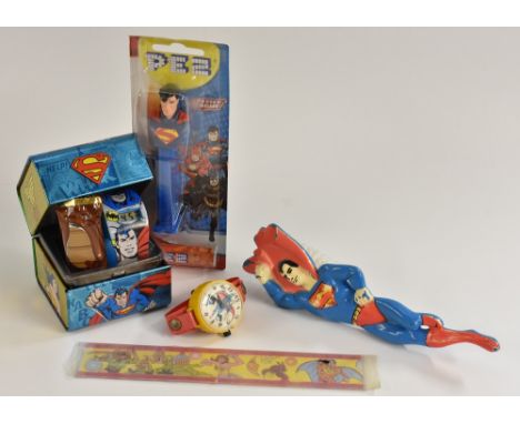 Suoerman - a Superman digital watch, by Marx; a Superman Pez, in packaging; a Superman flicker ruler; a Superman nail brush; 