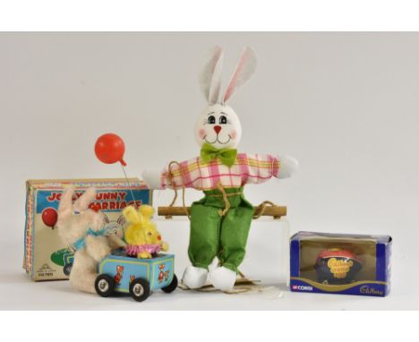 A Japanese Jolly bunny cub carriage, windup, tinplate and plush; a Corgi Cadburys Creme Egg car, in original box; an Easter b