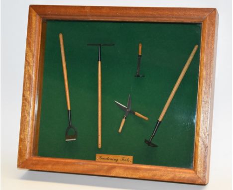 An array of Dolls house gardening tools, in presentation case