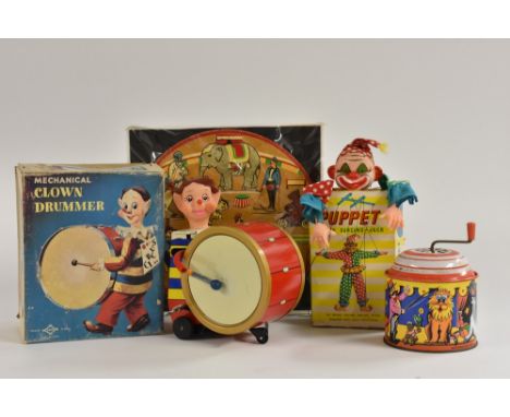 A Daiya, Japan wind-up tin plate Mechanical Clown Drummer, boxed; a Circus musical box; a Dancing Jack hand puppet, plastic, 