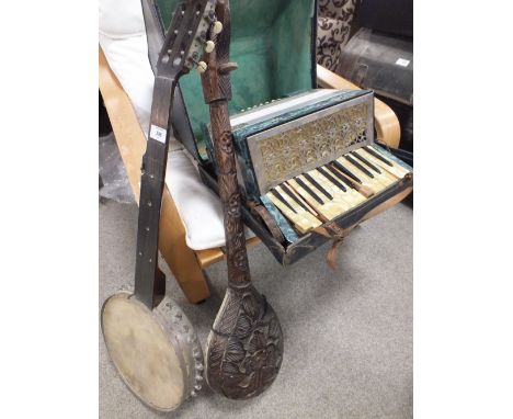 A VINTAGE BANJO A/F TOGETHER WITH AN UNUSUAL CARVED EXAMPLE AND A CASED VINTAGE GERMAN PIETRO ACCORDION A/F (3)
