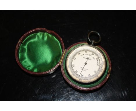 A LEATHER CASE POCKET BAROMETER