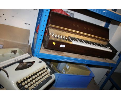 A HOHNER ELECTRIC ORGAN A/F TOGETHER WITH A PORTABLE ALDER TYPEWRITER
