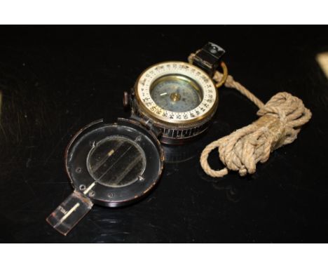 A WWII MILITARY COMPASS AND LANYARDS