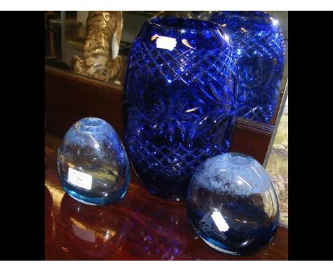 A blue glass vase, together with two Caithness vases 