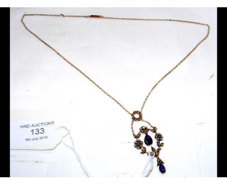 A decorative Edwardian seed pearl and amethyst pendant on chain  CONDITION REPORTStamped 9ct; stones are intact.