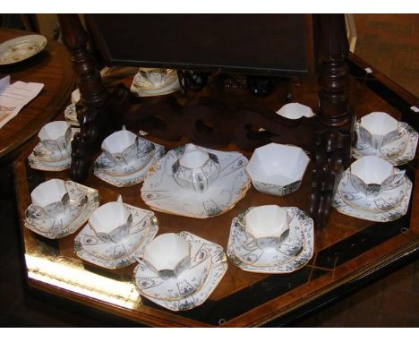 A 37 piece Shelley art deco style 'Queen Anne' patterned teaset CONDITION REPORTHairline cracks in two plates; hairline crack