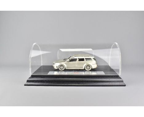 Audi scale model of the RA4 Avant Quattro, cast metal, with a metal plaque with engine data and performance data. Supported o