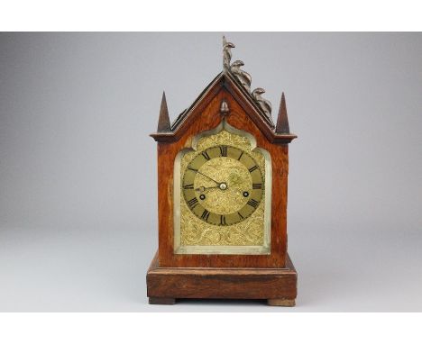 Mahogany mantel clock, gilt brass face with Roman dial, approx 9.5 x 13 cms, strikes to a bell, approx 14 x 24 cms. (af)