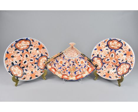 Japanese Imari plates, including one Meiji period dish shaped as a fan painted with peony and heightened with gilt approx 28 