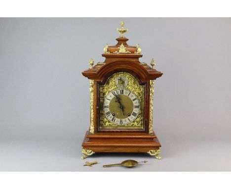 German walnut-cased bracket clock, (R.M Schneckenburger) having a brass dial with a 5" Roman chapter ring framing a matted ce