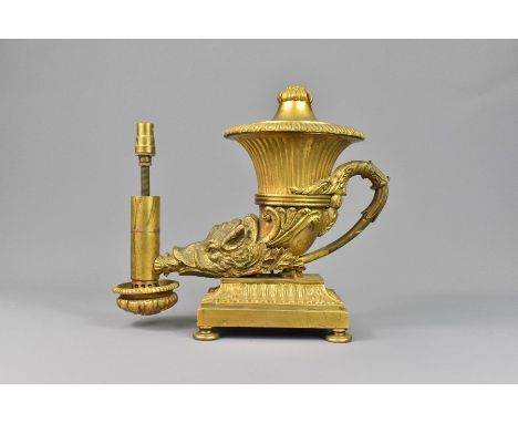 Regency Ormolu Rhyton oil lamp base, cast with a boars head beneath a fluted reservoir, supporting a glass funnel, this lamp 