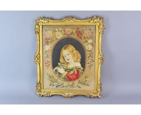 A needlepoint tapestry depicting a young girl and her cat, approx 33w x 41 h cms, framed and glazed together with a wool tape